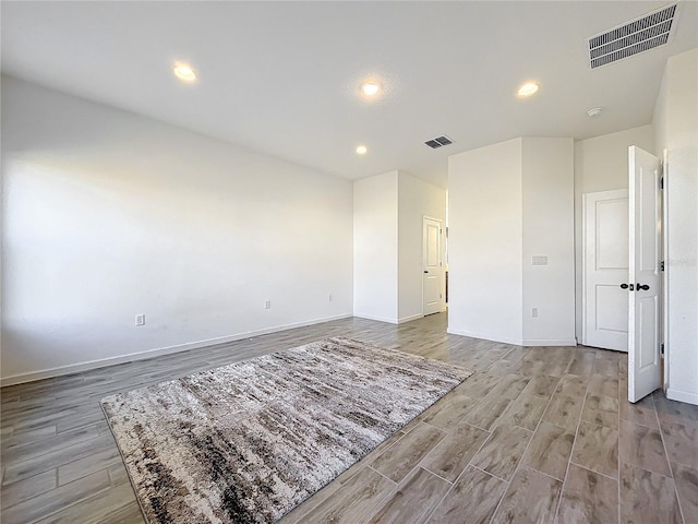 unfurnished room with light hardwood / wood-style floors