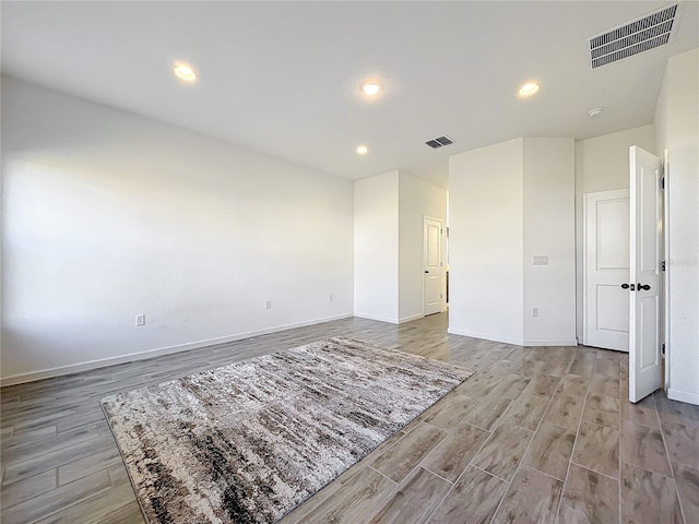 4408 Renly Ln, Clermont, FL 34711 - empty room featuring light wood finished floors and recessed lighting