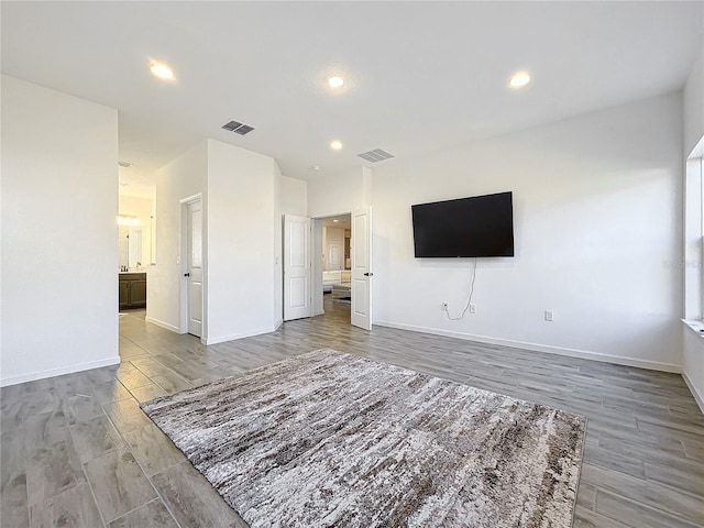 4408 Renly Ln, Clermont, FL 34711 - unfurnished living room featuring wood finished floors and recessed lighting