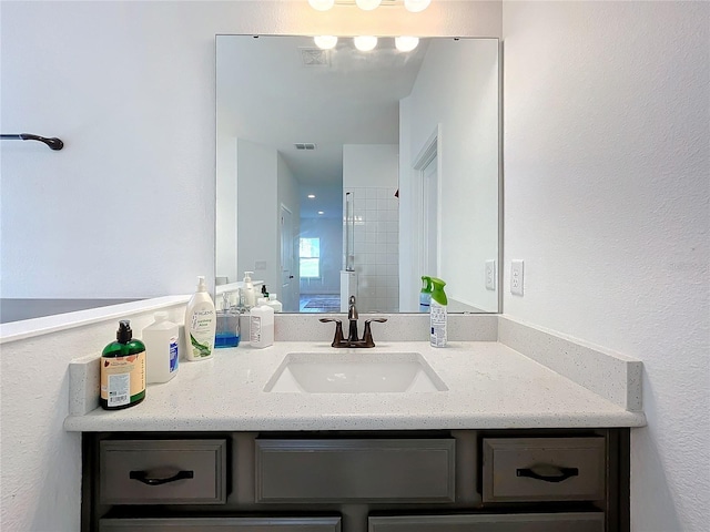 bathroom featuring vanity and walk in shower