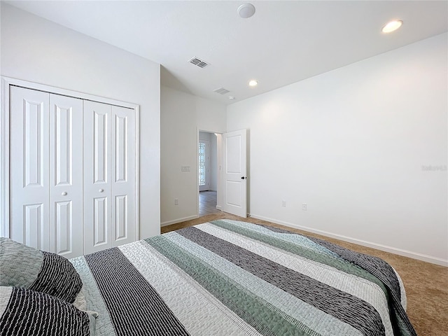 carpeted bedroom featuring a closet