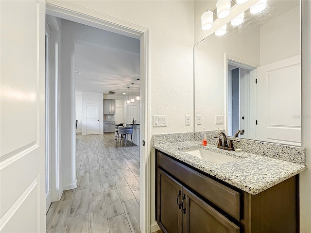 bathroom with vanity and wood-type flooring