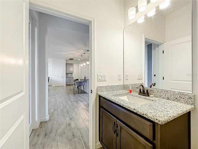 4408 Renly Ln, Clermont, FL 34711 - bathroom with a chandelier, vanity, and wood finished floors