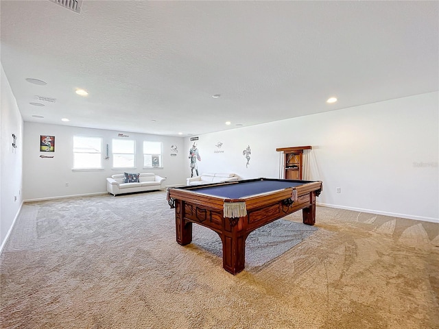 playroom with a textured ceiling, light colored carpet, and pool table