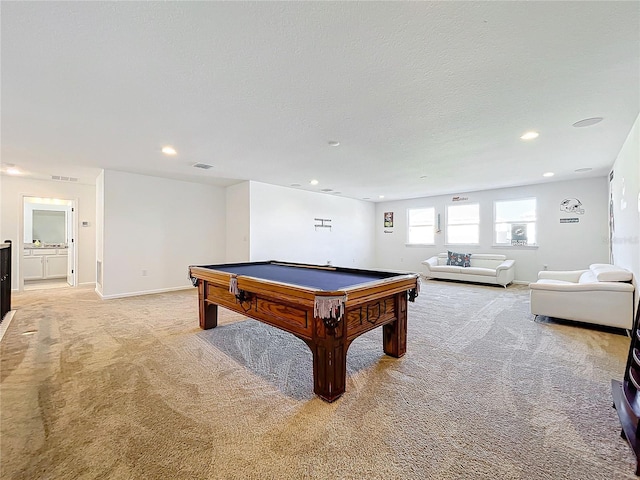 playroom featuring light carpet, a textured ceiling, and billiards