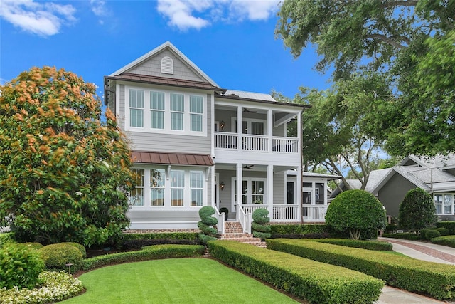 view of front of house with ceiling fan and covered porch