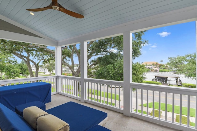 sunroom featuring ceiling fan and lofted ceiling