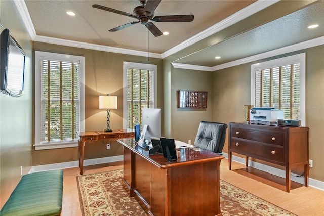 office area with ceiling fan, light hardwood / wood-style floors, ornamental molding, and a textured ceiling