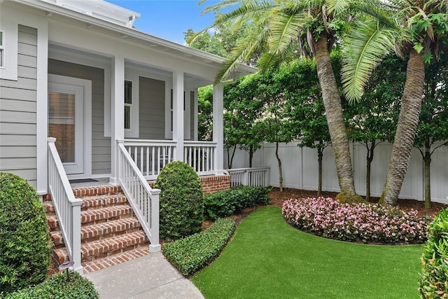 view of yard featuring covered porch