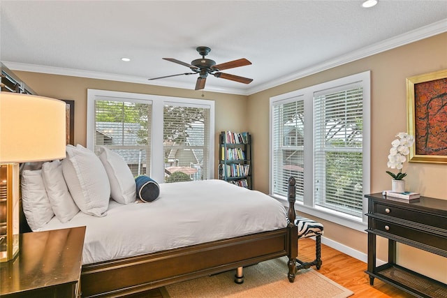 bedroom featuring ceiling fan, light wood-style flooring, recessed lighting, baseboards, and ornamental molding