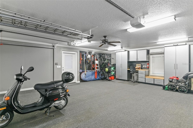 garage featuring ceiling fan and a garage door opener