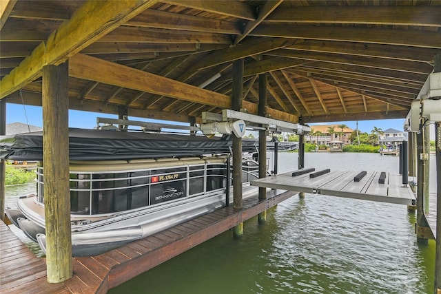 view of dock with a water view and boat lift