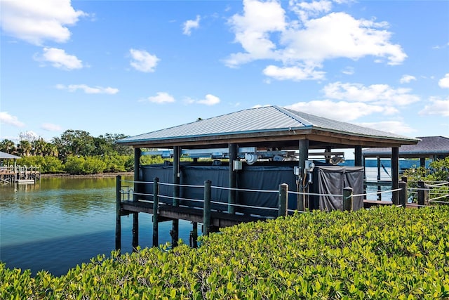 dock area featuring a water view and boat lift