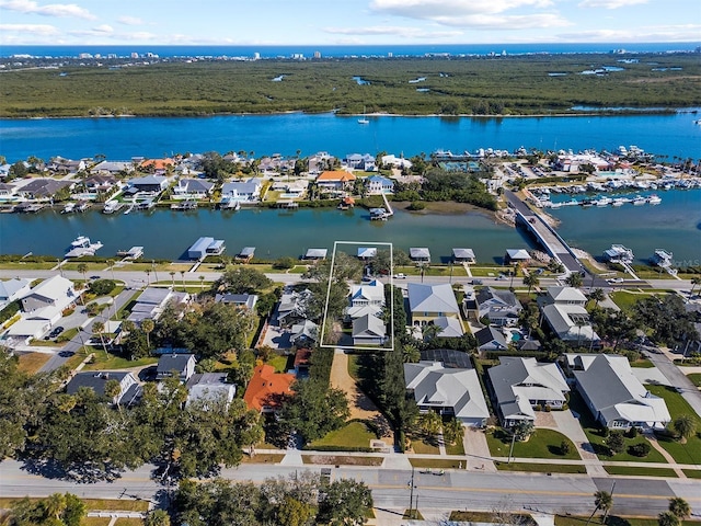 birds eye view of property featuring a water view and a residential view