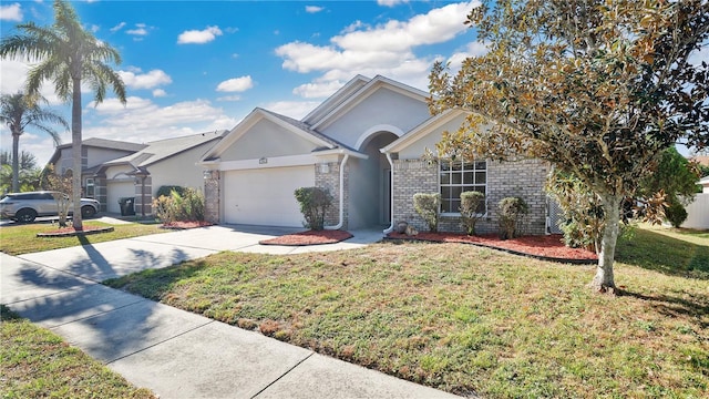 single story home featuring a front lawn and a garage