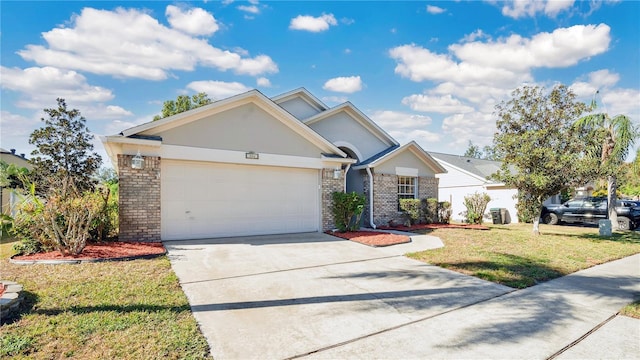 view of front of house with a garage and a front lawn