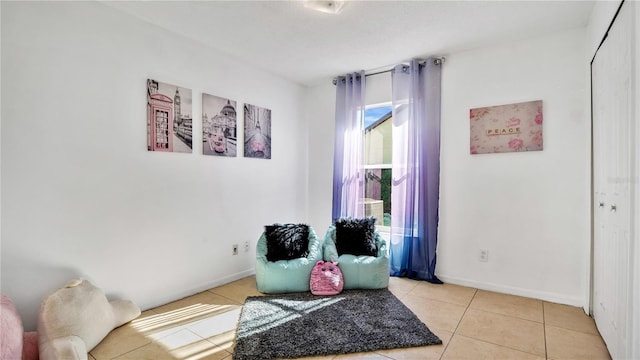 sitting room with light tile patterned floors