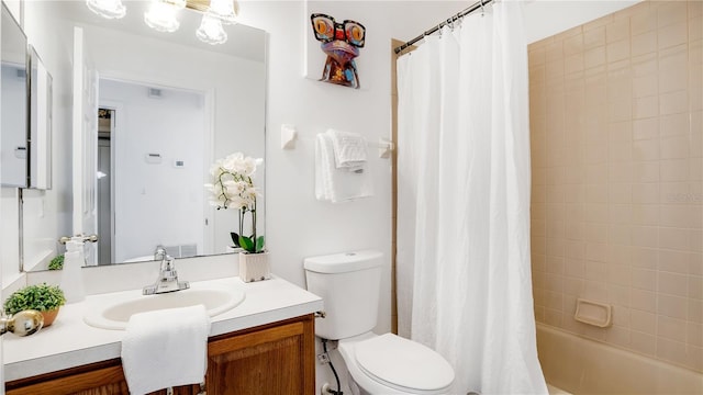 full bathroom featuring toilet, vanity, and shower / bath combo with shower curtain