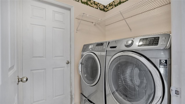 laundry area with independent washer and dryer