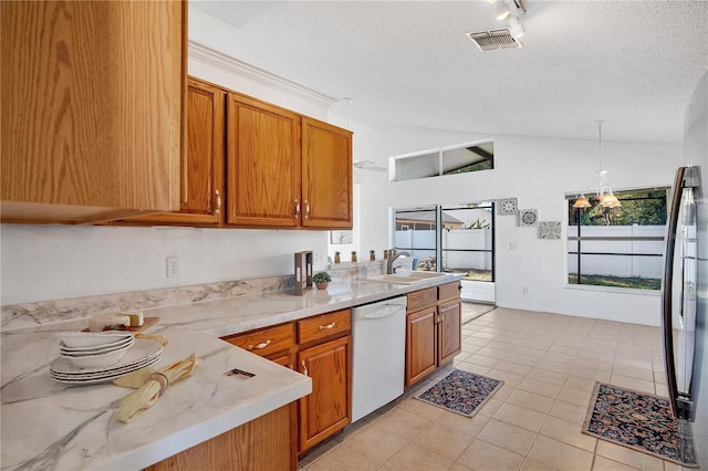 kitchen with a textured ceiling, dishwasher, decorative light fixtures, an inviting chandelier, and vaulted ceiling