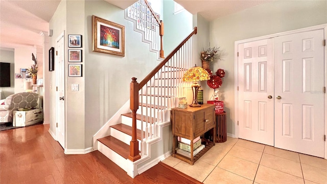 stairs with hardwood / wood-style floors