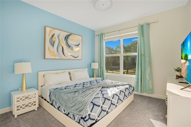 carpeted bedroom featuring multiple windows