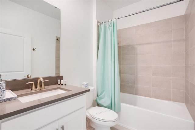 full bathroom featuring vanity, shower / tub combo, and toilet