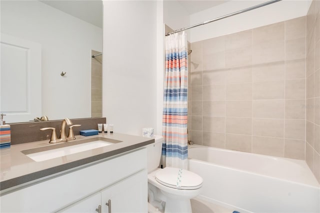 full bathroom featuring vanity, shower / tub combo, and toilet