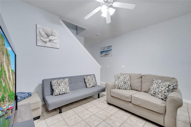 living room with ceiling fan and light tile patterned flooring