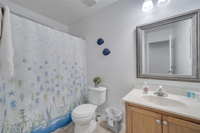 bathroom with tile patterned floors, vanity, a shower with shower curtain, and toilet