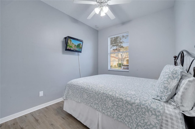 bedroom with ceiling fan and wood-type flooring