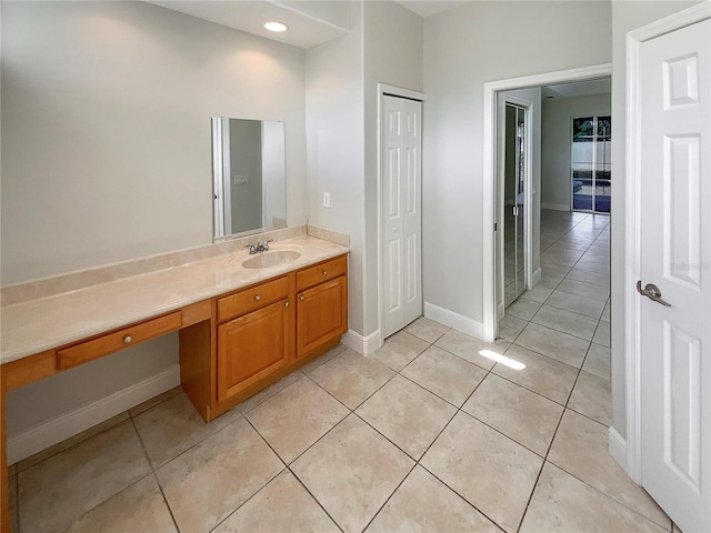 bathroom featuring tile patterned flooring and vanity