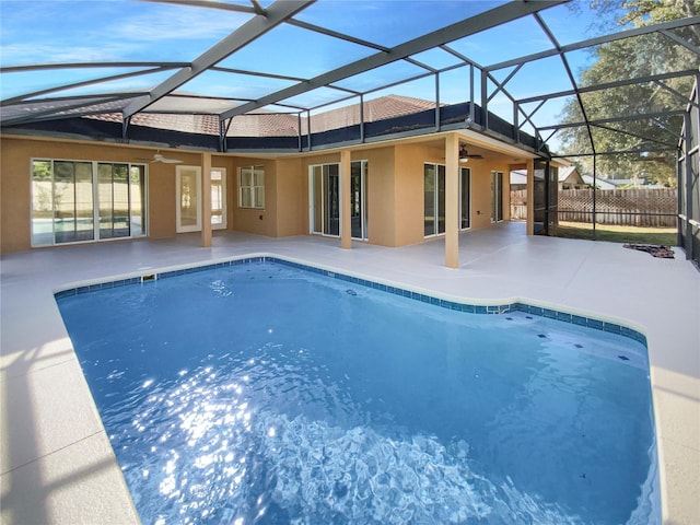 view of pool with a patio area, ceiling fan, and a lanai