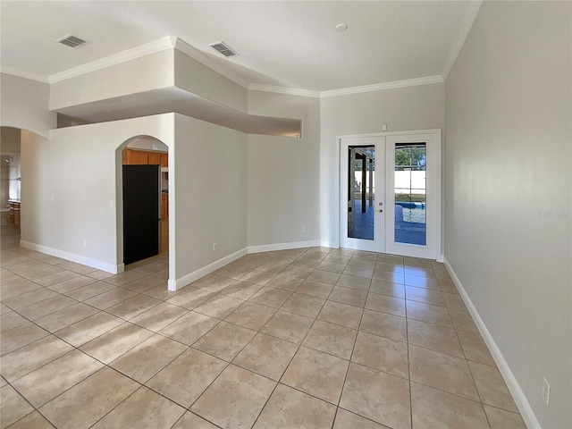 tiled empty room featuring french doors and crown molding