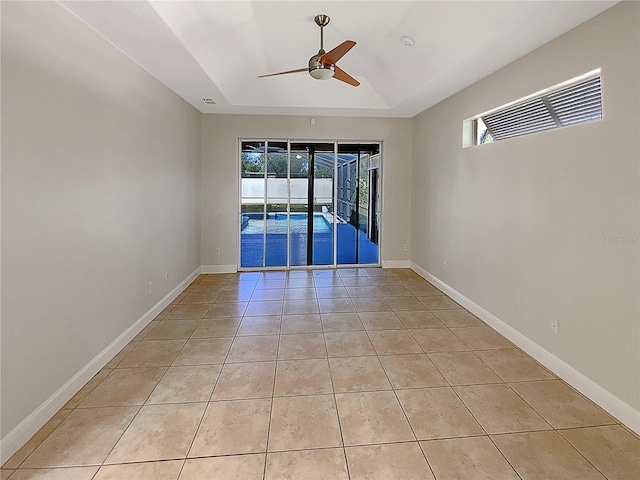 unfurnished room featuring ceiling fan and light tile patterned flooring