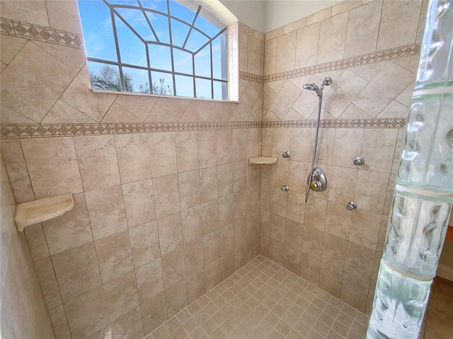 bathroom featuring a tile shower