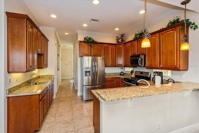 kitchen featuring light stone countertops, sink, stainless steel appliances, kitchen peninsula, and decorative light fixtures