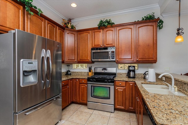 kitchen with stainless steel appliances, crown molding, sink, light tile patterned floors, and hanging light fixtures