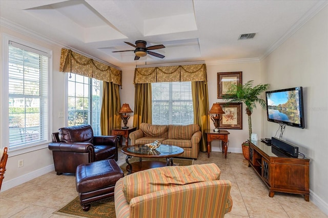 tiled living room with ceiling fan and crown molding