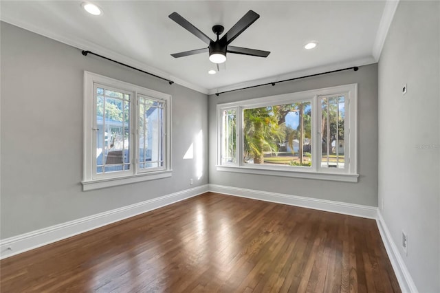 spare room with ceiling fan, crown molding, and hardwood / wood-style floors