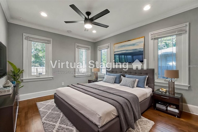 bedroom with ceiling fan, multiple windows, dark hardwood / wood-style flooring, and ornamental molding