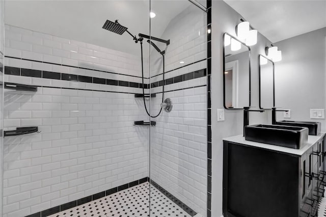 bathroom featuring vanity and a tile shower