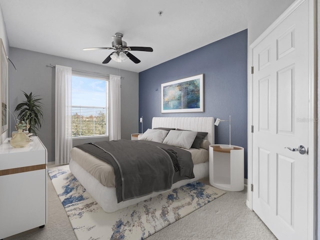 carpeted bedroom with ceiling fan