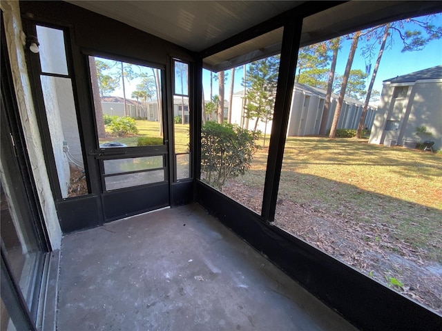 unfurnished sunroom featuring plenty of natural light