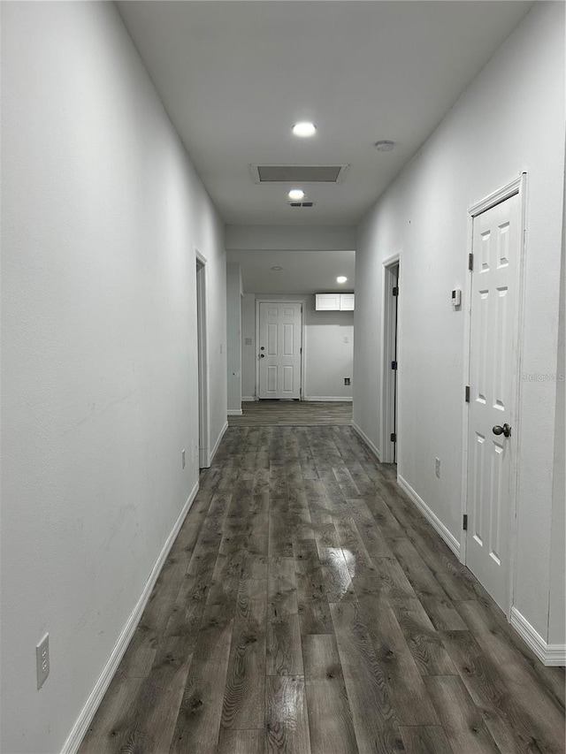 hall with dark hardwood / wood-style floors