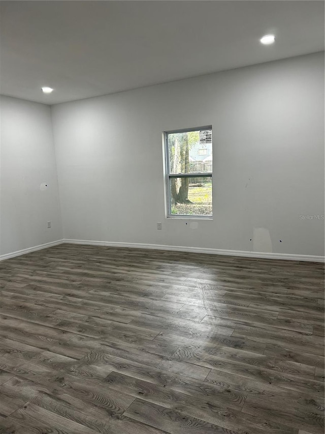 empty room featuring dark hardwood / wood-style floors