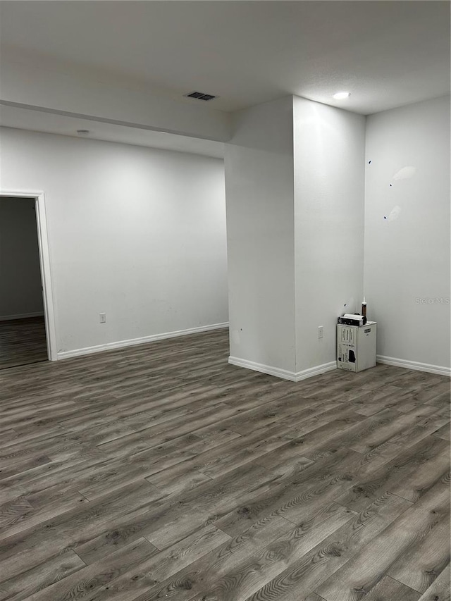 spare room featuring dark hardwood / wood-style flooring