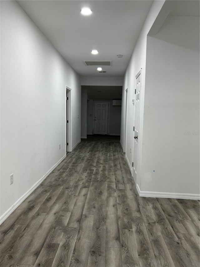 hallway with dark wood-type flooring