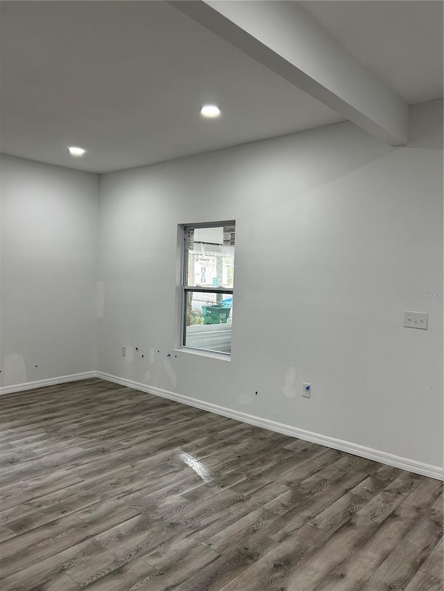 spare room with dark hardwood / wood-style flooring