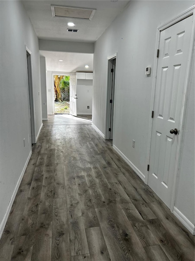 hall featuring dark wood-type flooring